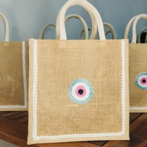 Evil eye motif jute bag